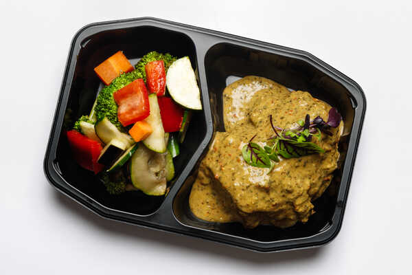 Oven Roasted Greek Seasoned Chicken Breast with Special Greek sauce and Lemon Wedge